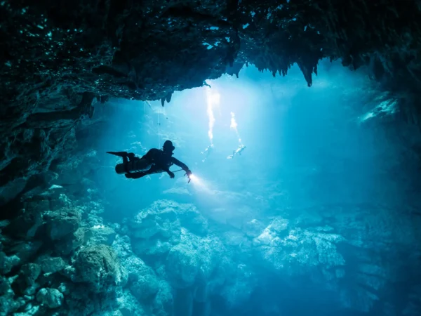 The Pit Cenote Dive with Beams of Light and Stunning Rock Formations